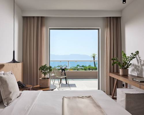 
View of the balcony and the sea from inside the room